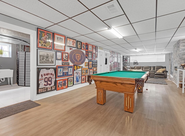 game room featuring wood-type flooring, billiards, and a paneled ceiling