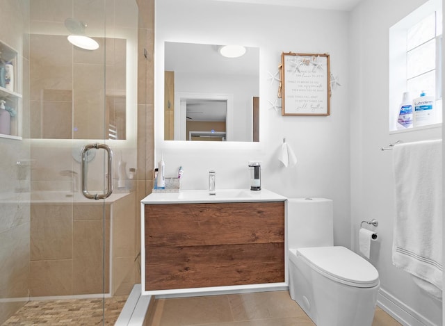 bathroom with walk in shower, vanity, and toilet