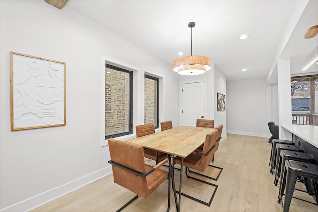 dining area featuring recessed lighting, baseboards, and light wood finished floors