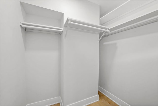 spacious closet with wood finished floors