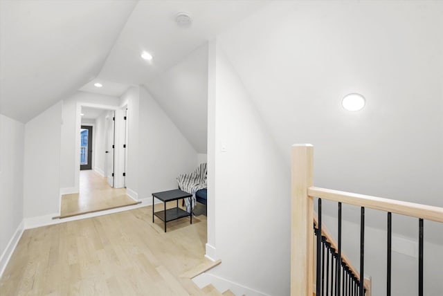 additional living space featuring vaulted ceiling, recessed lighting, wood finished floors, and baseboards