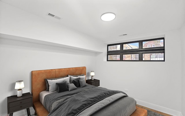 bedroom with visible vents and baseboards