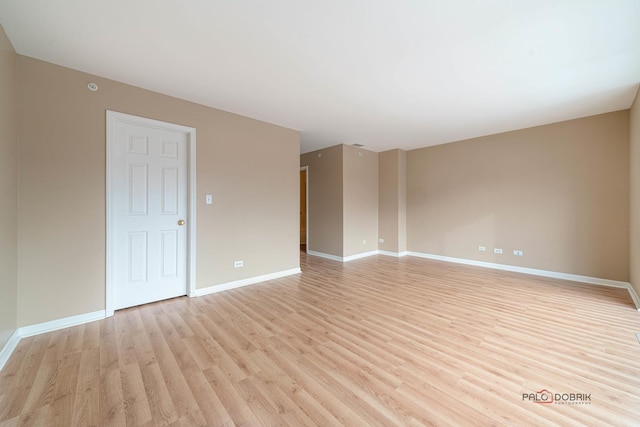 spare room with light hardwood / wood-style flooring