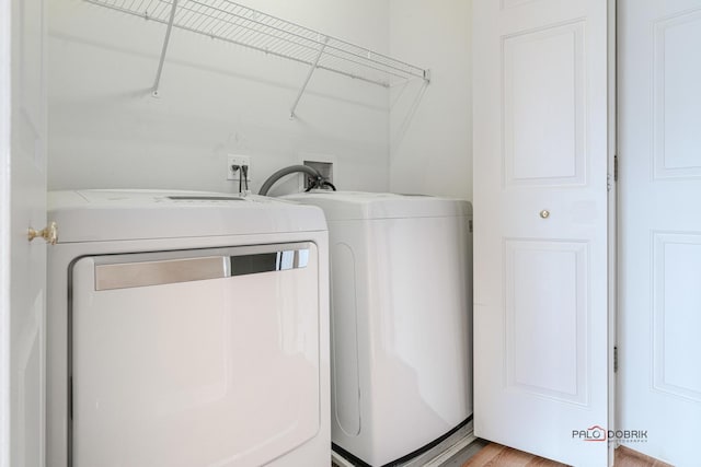 clothes washing area featuring washing machine and clothes dryer