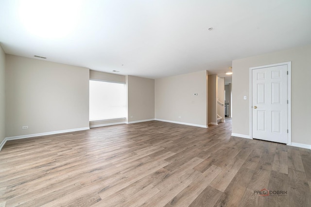 unfurnished room featuring light hardwood / wood-style flooring