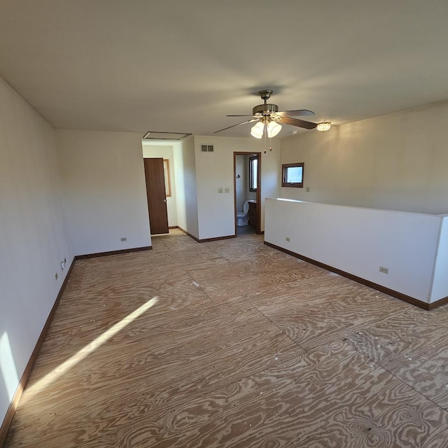 unfurnished room with ceiling fan