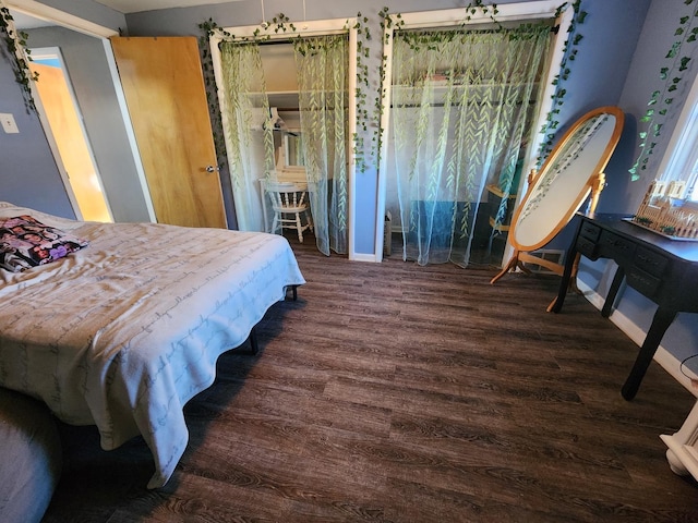 bedroom featuring dark wood-type flooring