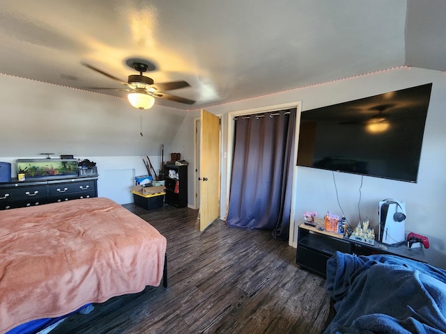 bedroom featuring vaulted ceiling, dark hardwood / wood-style floors, and ceiling fan