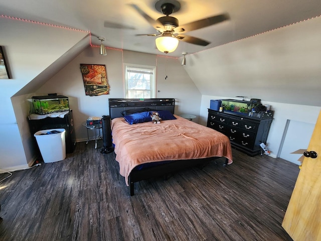 bedroom featuring lofted ceiling, dark hardwood / wood-style floors, and ceiling fan