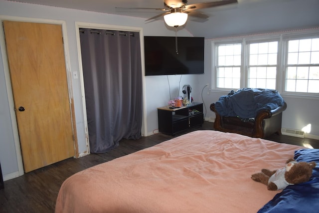 bedroom with dark wood-type flooring and ceiling fan