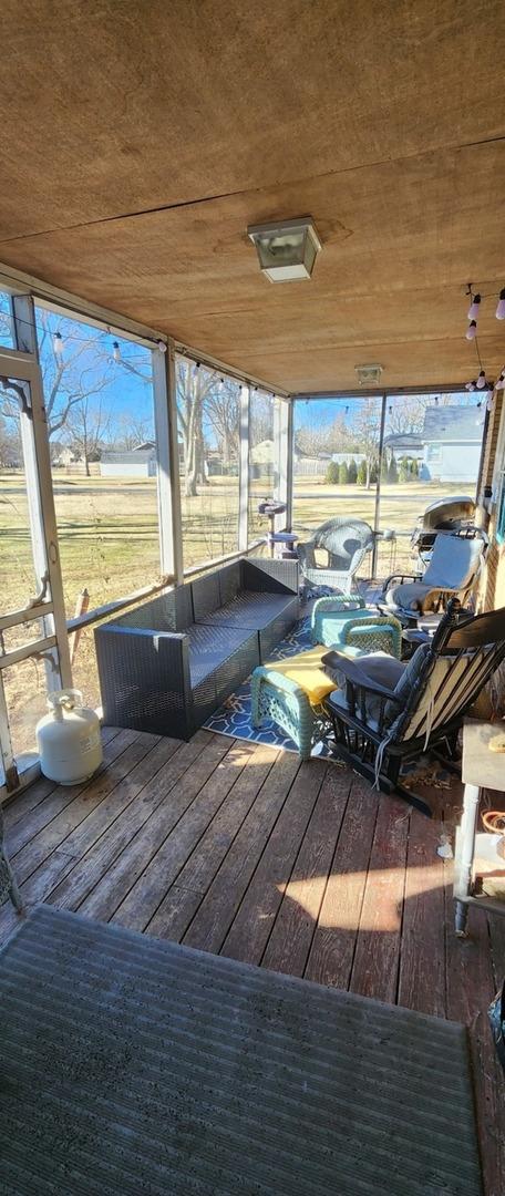 unfurnished sunroom featuring a rural view and wood ceiling