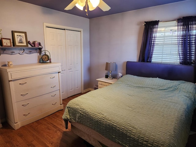 bedroom with ceiling fan, wood-type flooring, and a closet