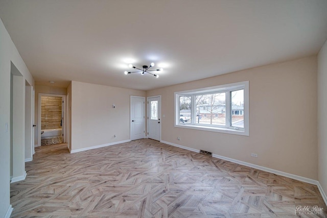 spare room with light parquet flooring