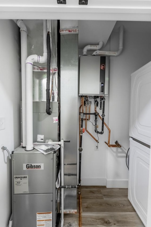 utilities with tankless water heater and washer / dryer