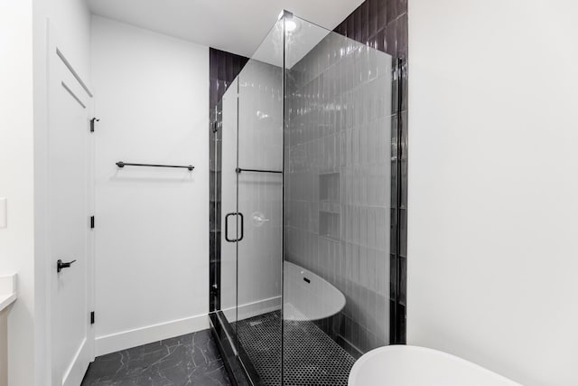 bathroom featuring separate shower and tub