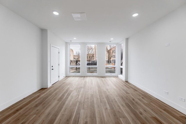 unfurnished living room featuring hardwood / wood-style floors