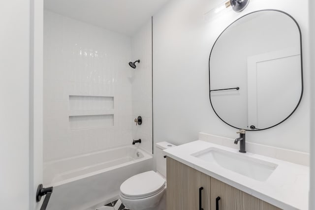 full bathroom with tiled shower / bath combo, vanity, and toilet