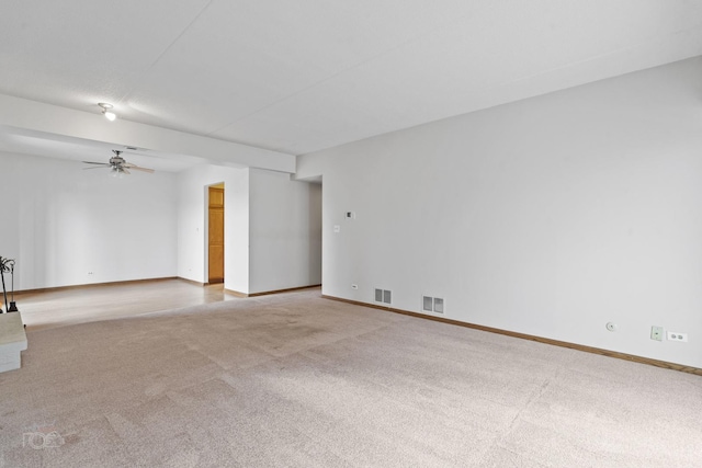 unfurnished room with light carpet and ceiling fan