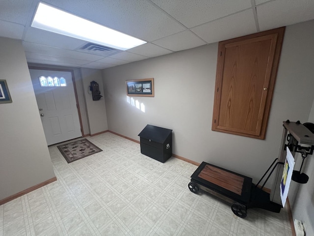 foyer entrance with a paneled ceiling