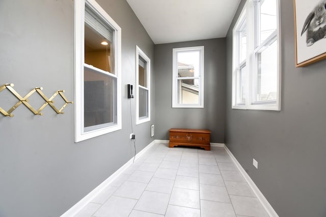 hallway featuring light tile patterned floors