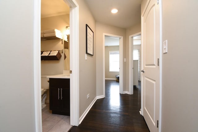 hall with dark hardwood / wood-style flooring