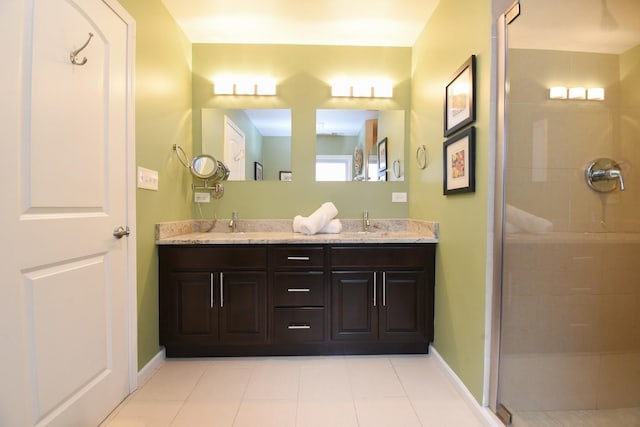 bathroom with vanity, tile patterned flooring, and a shower with shower door