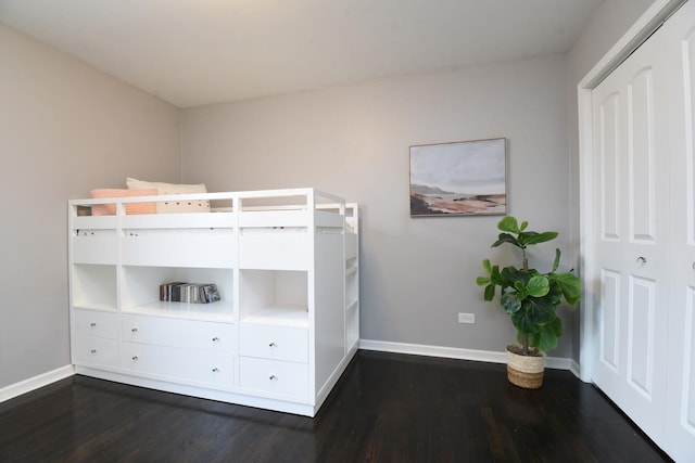 unfurnished bedroom with dark hardwood / wood-style floors