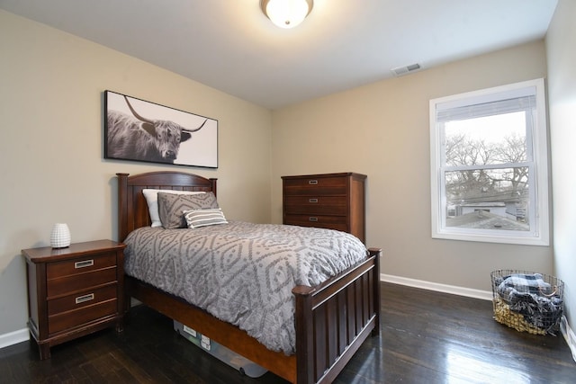 bedroom featuring dark wood-type flooring