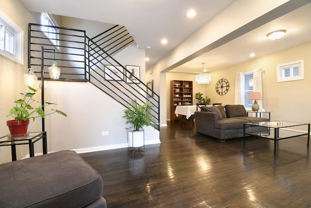 living room with dark hardwood / wood-style flooring