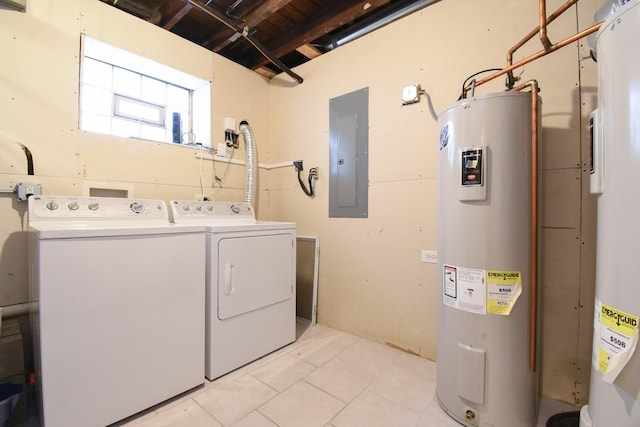 laundry room with water heater, washing machine and dryer, light tile patterned flooring, and electric panel