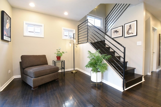 stairs featuring hardwood / wood-style floors