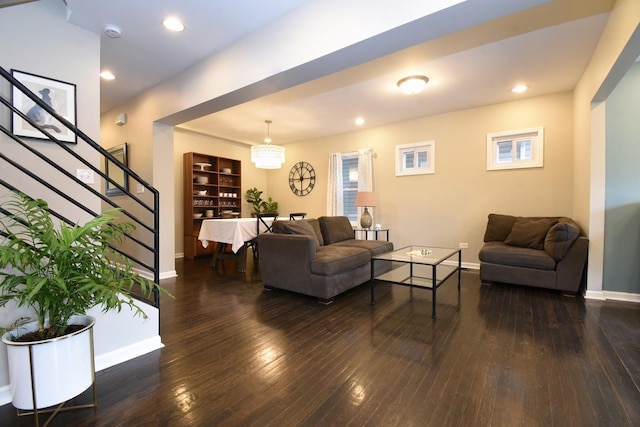 living room with dark hardwood / wood-style flooring