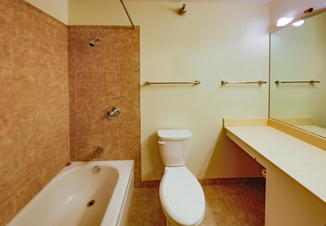 full bathroom featuring tile patterned floors, vanity, toilet, and tiled shower / bath combo