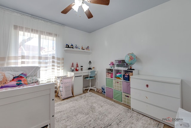 bedroom featuring ceiling fan and light hardwood / wood-style flooring