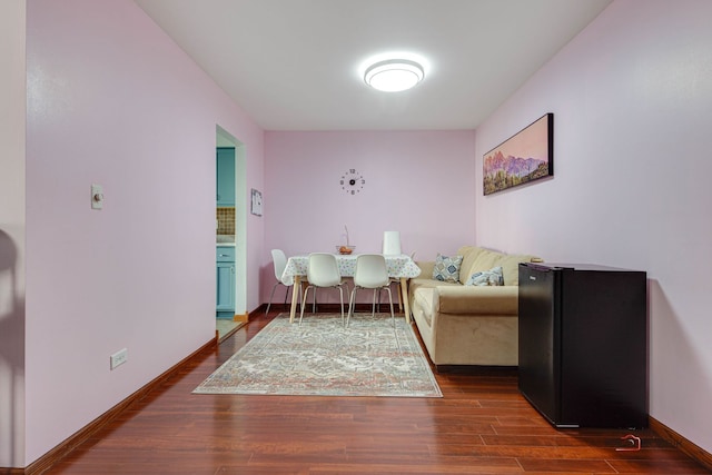 living area with dark hardwood / wood-style flooring