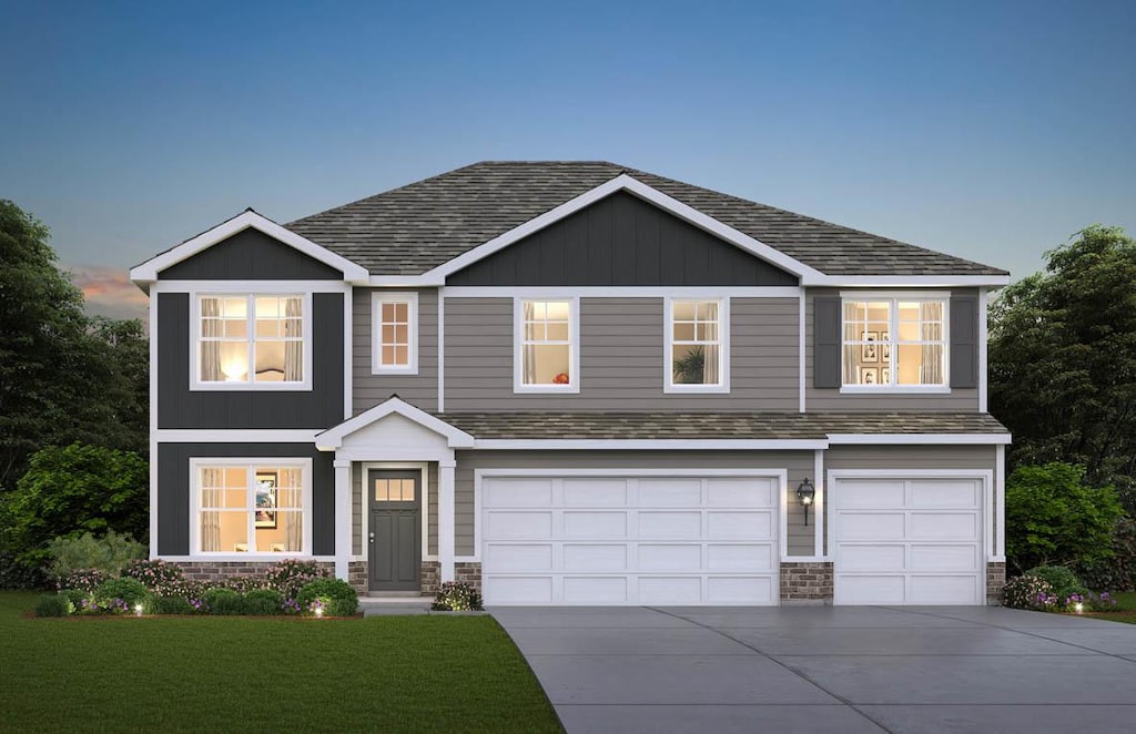 view of front facade featuring a yard and a garage