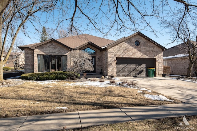 view of front of house featuring a garage and a front lawn