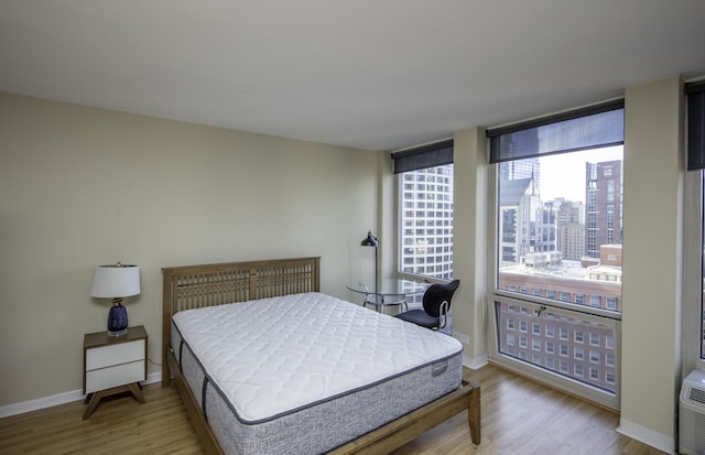 bedroom with wood-type flooring