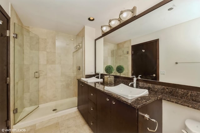 bathroom featuring vanity, an enclosed shower, and tile patterned flooring