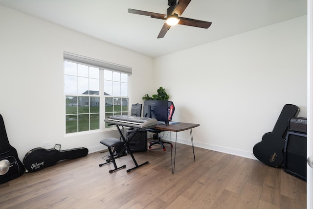 office space with ceiling fan and light wood-type flooring