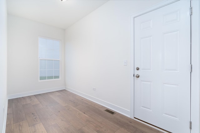 unfurnished room featuring light wood-type flooring