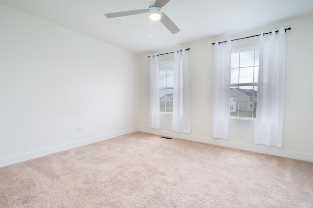 unfurnished room featuring carpet floors and ceiling fan