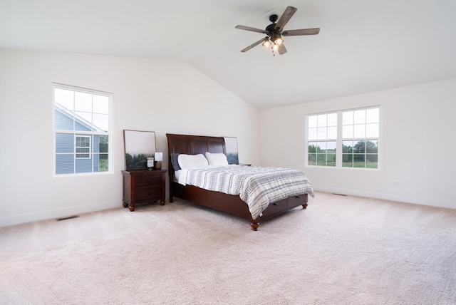 bedroom with lofted ceiling, light carpet, and ceiling fan