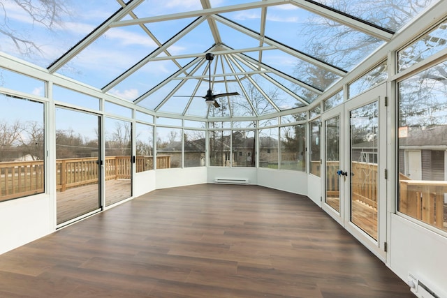 unfurnished sunroom featuring a baseboard radiator