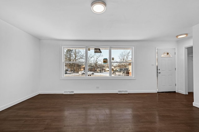 interior space with dark hardwood / wood-style flooring