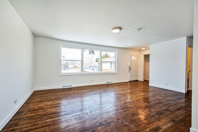 empty room featuring dark hardwood / wood-style floors