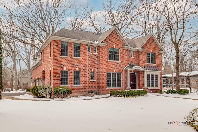 view of front of property featuring brick siding