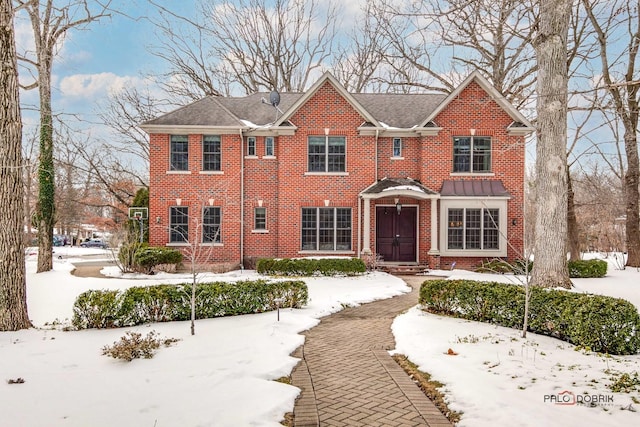 view of front of home featuring brick siding