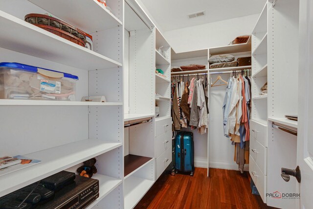 walk in closet featuring wood finished floors and visible vents