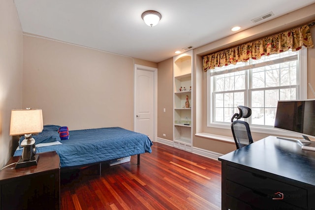 bedroom with visible vents, recessed lighting, baseboards, and wood finished floors